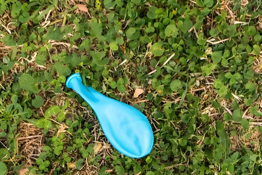 balloons pop when they touch grass